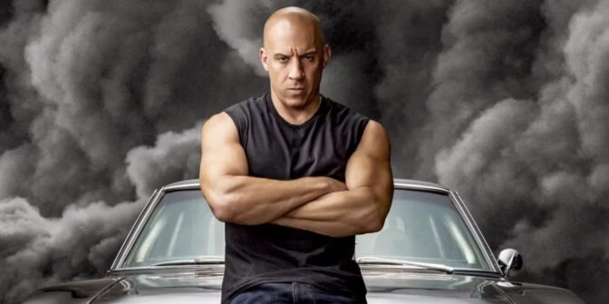 Vin Diesel. I bakgrunden släpper hans bil på egen hand ut tillräckligt med koldioxid för att dra upp den globala uppvärmningen till 3 grader.